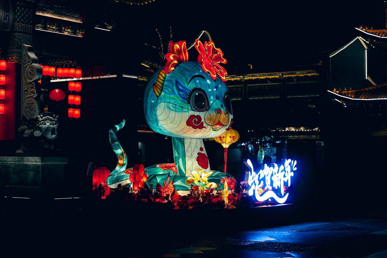 Colorful dragon lantern display at night during Chinese New Year celebration.