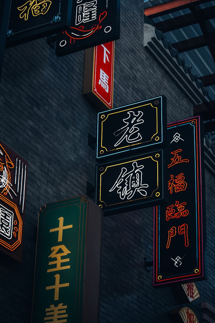 Colorful traditional Chinese signs in Jakartas Chinatown at night, capturing cultural essence.