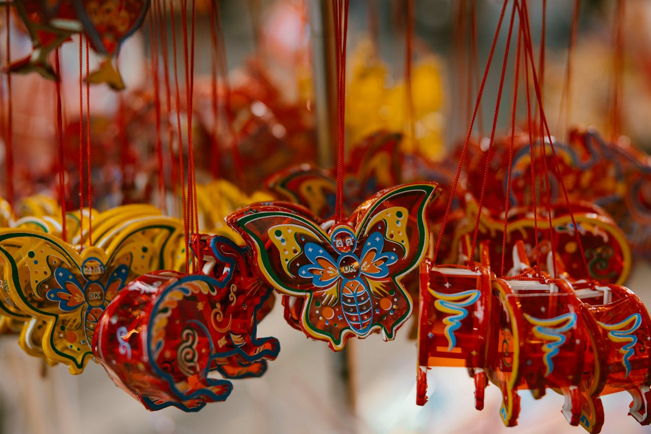 Colorful hanging decorations with traditional designs, perfect for festivals and cultural celebrations.